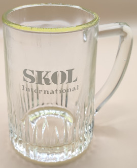 Skol International half pint tankard glass